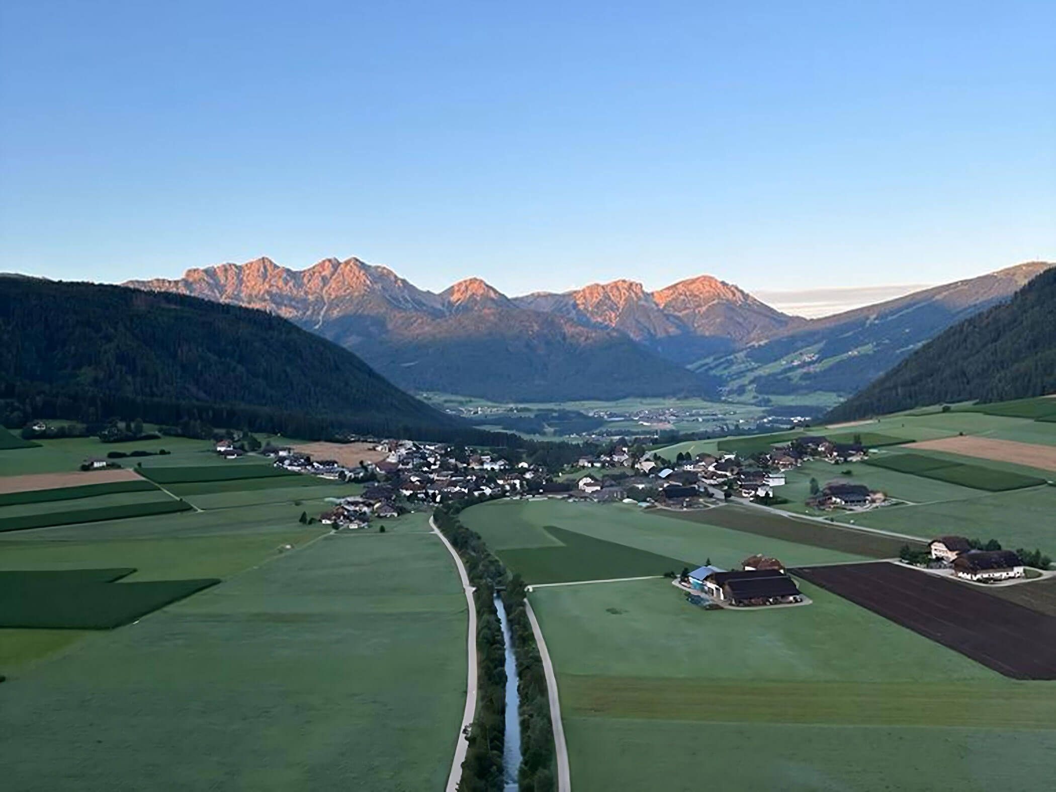The village of Rasun di Sopra from above in summer - Branterhof